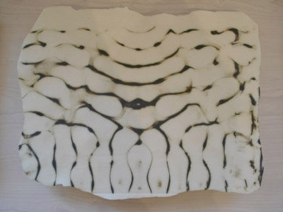 Playing a frequency pattern in iron oxide on copper plate